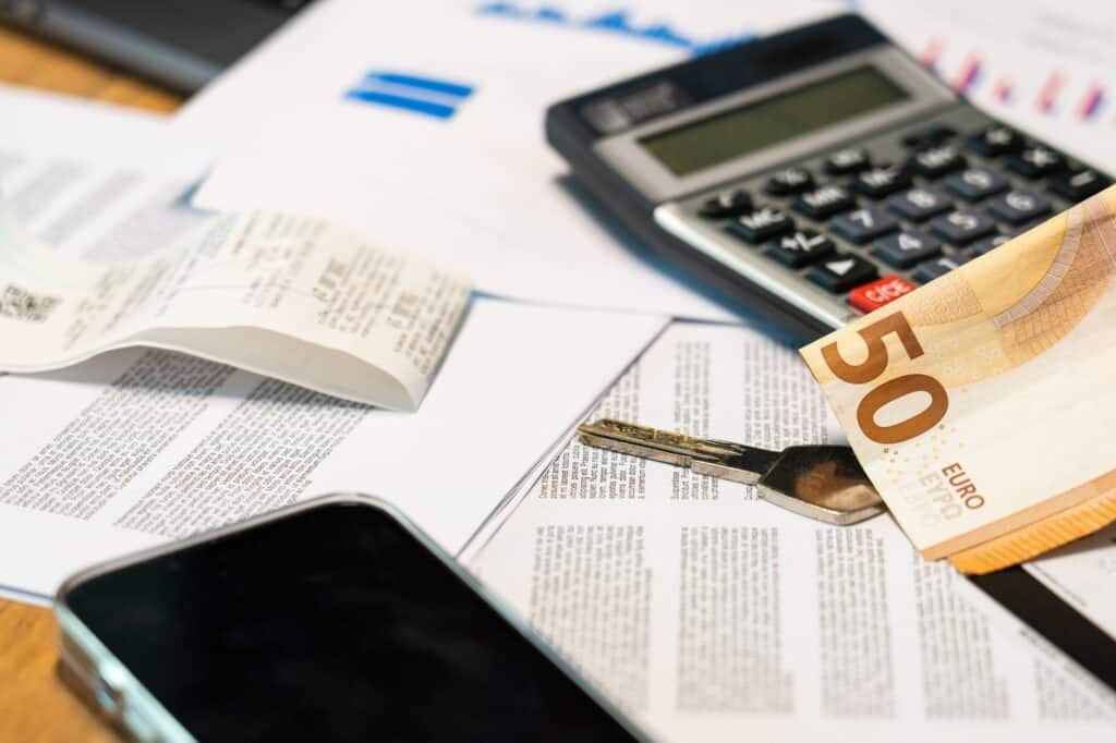 How Much Does an IPTV Box Cost? Budget to Premium Calculator and euro banknote on paperwork