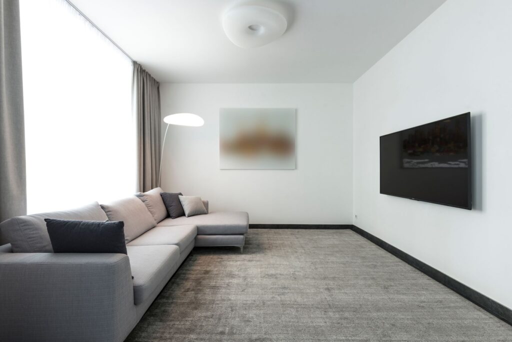 How to Set Up IPTV on Apple TV Minimalist living room with a wall-mounted television
