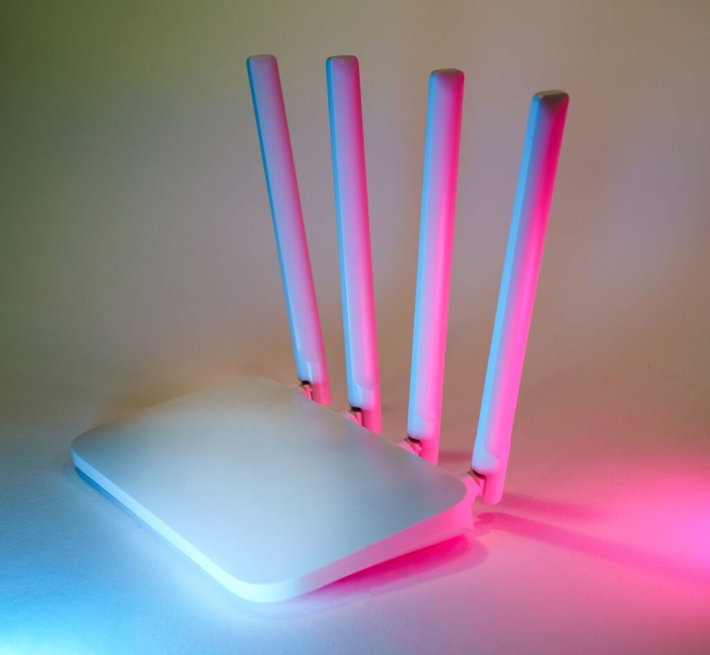 Why Does IPTV Keep Buffering? How to Fix It WiFi router with glowing indicator lights